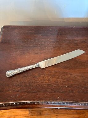 Ornate Silver-Handle Cake Knife - Decorative Floral Pattern